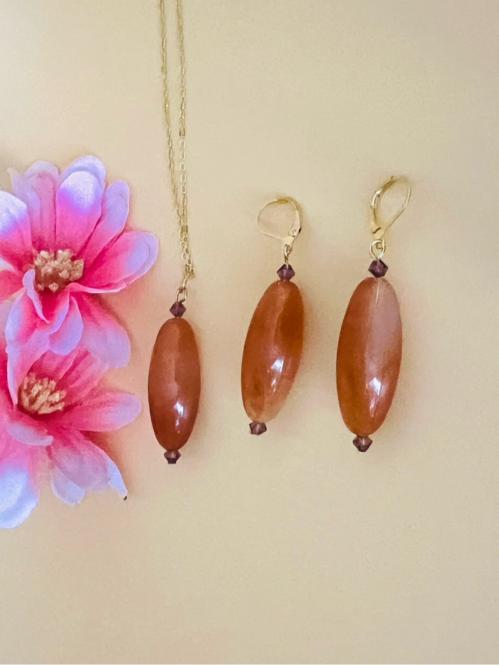 Gold plated long brown earrings set with crystal accents